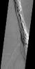This image released on Nov 19, 2004 from NASA's 2001 Mars Odyssey shows collapse pits are found in graben located in Tractus Catena on Mars. These features are related to subsidence after magma chamber evacuation of Alba Patera.