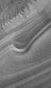 NASA's Mars Global Surveyor shows an exposure of finely-detailed layers in the martian north polar region. The north polar ice cap, which is made up of frozen water, is underlain by a thick sequence of layers.