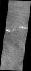 This image from NASA's Mars Odyssey shows a portion of the flank of Olympus Mons on Mars. Many flows have a central channel with raised edges and are fairly narrow.