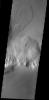 This image from NASA's Mars Odyssey shows landslide in this image originating from the steep escarpment which surrounds the Olympus Mons volcano on Mars. This landslide is located on the northern side of the volcano.