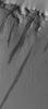 NASA's Mars Global Surveyor shows several large, dark slope streaks formed on the wall of a trough on the lower north flank of the giant Tharsis shield volcano, Pavonis Mons.