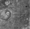 This image, part of THEMIS art month, taken by NASA's Mars Odyssey features a portion of Mars' landscape looking like a face staring at the spacecraft.