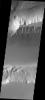 This image taken by NASA's Mars Odyssey shows Kasei Vallis which contains a feature type on Mars called a Mensa, from the Latin word for 'table.' A Mensa is a flat-topped prominence with cliff-like edges.