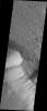 This image taken by NASA's Mars Odyssey shows Olympus Mons which contains a a feature type on Mars called a Mensa, from the Latin word for 'table.' A Mensa is a flat-topped prominence with cliff-like edges.