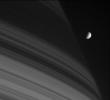 As the closest-orbiting of Saturn's intermediate-sized moons, Mimas is occasionally captured against the planet's dim and shadowed northern latitudes. This image was taken with NASA's Cassini spacecraft's narrow-angle camera on July 18, 2005.