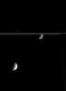 With the icy rings between them, Dione and Tethys each show off the prominent features for which they are known. Dione displays wispy fractures that adorn its trailing side. Tethys, closest to NASA's Cassini spacecraft, shows its impact basin Odysseus.