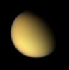 As NASA's Cassini spacecraft approached Titan on Aug. 21, 2005, it captured this natural color view of the moon's orange, global smog.