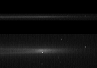This frame from a movie shows a bright arc of material flashing around the edge of Saturn's G ring, a tenuous ring outside the main ring system. The images were acquired by NASA's Cassini spacecraft's narrow-angle camera on April 25, 2006.