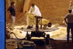 Rover engineers prepare a mixture of sandy and powdery materials to simulate some difficult Mars driving conditions inside a facility at NASA's Jet Propulsion Laboratory, Pasadena, Calif. 