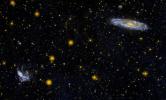 This ultraviolet image from NASA's Galaxy Evolution Explorer is of the interacting group of galaxies known as Stephan's Quintet (NGC 7317, NGC 7318A, NGC 7318B, NGC 7319, NGC 7320, lower left).