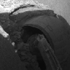 The right front wheel of NASA's Mars Exploration Rover Opportunity made slow but steady progress through soft dune material in this image taken by the rover's front hazard identification camera over a period of several days. 