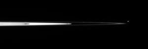 Staring toward the outer edge of Saturn's main rings, NASA's Cassini spacecraft spots Pandora and tiny Atlas. Several clumps are visible in the narrow F ring, as well as multiple dusty strands flanking the F ring core.