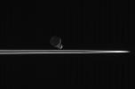 As our robotic emissary to Saturn, NASA's Cassini spacecraft is privileged to behold such fantastic sights as this pairing of two moons beyond the rings. The bright, narrow F ring is the outermost ring structure seen
here.