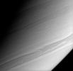 Long, thin streamers of cloud arc gracefully across this view of Saturn's southerly latitudes as seen by NASA's Cassini spacecraft.
