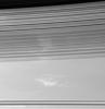 The soft, sweeping shadows of Saturn's C ring cover bright patches of clouds in the planet's atmosphere. The shadow-throwing rings stretch across the view at bottom. The dark inner edge of the B ring is visible at top as seen by NASA's Cassini spacecraft.