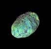 This extreme false-color view of Saturnian moon Hyperion shows color variation across the impact-blasted surface of the tumbling moon in this image from NASA's Cassini spacecraft .