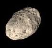 Unlike most of the dull grey moons in the Solar System, Hyperion's color is a rosy tan and looks like a spongy potato, as shown is this view from NASA's Cassini spacecraft.