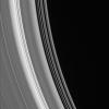Bright ringlets and dark gaps at the inner edge of the C ring sweep across this scene. The C ring contains numerous 'plateaus' -- broad ring regions that are bright and surrounded by fainter material as seen by NASA's Cassini spacecraft.