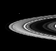 This frame from a movie begins with a view of the sunlit side of the rings. As the spacecraft speeds from south to north, the rings appear to tilt downward and collapse to a thin plane.