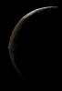 The slim crescent of Iapetus looms before NASA's Cassini spacecraft as it approaches the mysterious moon on Sept 10, 2007.