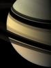 NASA's Cassini spacecraft regards the shadow-draped face of Saturn. The rings cast their mirror image onto the planet beyond.