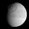 The vast expanse of the crater Odysseus spreads out below NASA's Cassini spacecraft in this mosaic view of Saturn's moon Tethys. Tethys is 1,071 kilometers (665 miles) across.