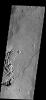 These curved fractures on Mars are located on the margin between Memnonia Fossae and Elysium Planitia as seen by NASA's 2001 Mars Odyssey.