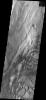 This sand sheet and dune field occurs on the floor of Candor Chasma on Mars as seen by NASA's 2001 Mars Odyssey spacecraft.