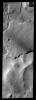 This image is from NASA's 2001 Mars Odyssey. THEMIS ART IMAGE #61 With an impact crater for an eye - this layer of material resembles a large fish.