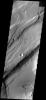This image is from NASA's 2001 Mars Odyssey. THEMIS ART IMAGE #64 Give me a kiss, this depression looks like lips and what appears to be a bug in the upper left.