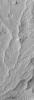 NASA's Mars Global Surveyor shows sinuous ridges and other landforms exposed by erosion in the Aeolis region of Mars.