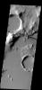 One of the Cerberus Fossae fractures cuts through the plains and highlands on Mars in this image from NASA's 2001 Mars Odyssey spacecraft.