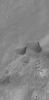 NASA's Mars Global Surveyor shows a small portion of the floor of Kaiser Crater in the Noachis Terra region, Mars. The terrain is covered by large windblown ripples and a few smoother-surfaced sand dunes.