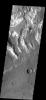 This image is located in the Tyrrhena Terra region. The cause of the bright markings/material is unknown. It is possible that the formation of the channels are exposing a series of bright layered material on Mars as seen by NASA's Mars Odyssey spacecraft.