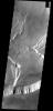This image shows a portion of the summit caldera of Olympus Mons on Mars as seen by NASA's Mars Odyssey spacecraft.