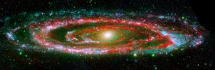 The many 'personalities' of our great galactic neighbor, the Andromeda galaxy, are exposed in this new composite image from NASA's Galaxy Evolution Explorer and Spitzer Space Telescope. 