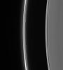 Prometheus dips into the inner F ring at its farthest point from Saturn in its orbit, creating a dark gore and a corresponding bright streamer as seen by NASA's Cassini spacecraft.