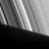 The Cassini Division appears to emerge out of Saturn's shadow in this image from NASA's Cassini spacecraft.