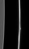 The F ring dissolves into a fuzzy stream of particles -- rather different from its usual appearance of a narrow, bright core flanked by dimmer ringlets. A bright clump of material flanks the ring's core as seen by NASA's Cassini spacecraft.