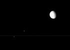 NASA's Cassini spacecraft views from edge-on with the rings are perfect for capturing multiple Saturnian moons grouped closely.