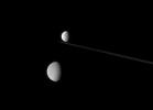 A string of icy moons stretches across the Saturn system in this view from nearly edge-on with the ringplane. This image was taken in visible light with NASA's Cassini spacecraft's narrow-angle camera.
