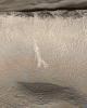 Two Martian southern mid-latitude craters have new light-toned deposit that formed in gully settings during the course of the Mars Global Surveyor mission.