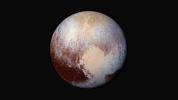 Four images from New Horizons' Long Range Reconnaissance Imager (LORRI) were combined with color data from the spacecraft's Ralph instrument to create this enhanced color global view of Pluto.