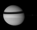 Dione and Tethys appear on opposite sides of the rings slide past each other in this stately portrait of Saturn taken by NASA's Cassini spacecraft.