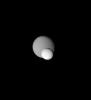 Two icy moons meet on the sky in a 'mutual event' recorded by NASA's Cassini spacecraft. The great brightness of Enceladus is rather obvious in comparison to Dione behind it.