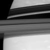 Saturn's rings cut across their own shadows on the planet and hide a tiny secret. Barely visible in the Encke Gap is the embedded moon Pan in this image captured by NASA's Cassini spacecraft on Sept. 18, 2007.