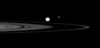 NASA's Cassini spacecraft observes a gathering of three moons, Mimas, Epimetheus, and Daphnis, near the rings of Saturn in this image taken on Oct. 3, 2007.