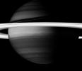 Saturn's rings create a brilliant halo around the turbulent giant planet. Here, NASA's Cassini spacecraft looks into Saturn's clouds using a spectral filter.