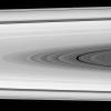 As NASA's Cassini spacecraft studies the rings, an icy interloper happens past. At the top of the image taken on Jan. 17, 2008, between the spacecraft and the rings, is Epimetheus.