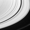 Embedded in Saturn's A ring is saucer-shaped Pan. The moon is seen here with two of the diffuse ringlets with which it shares the Encke Gap. NASA's Cassini spacecraft took this image on Feb. 12, 2008.